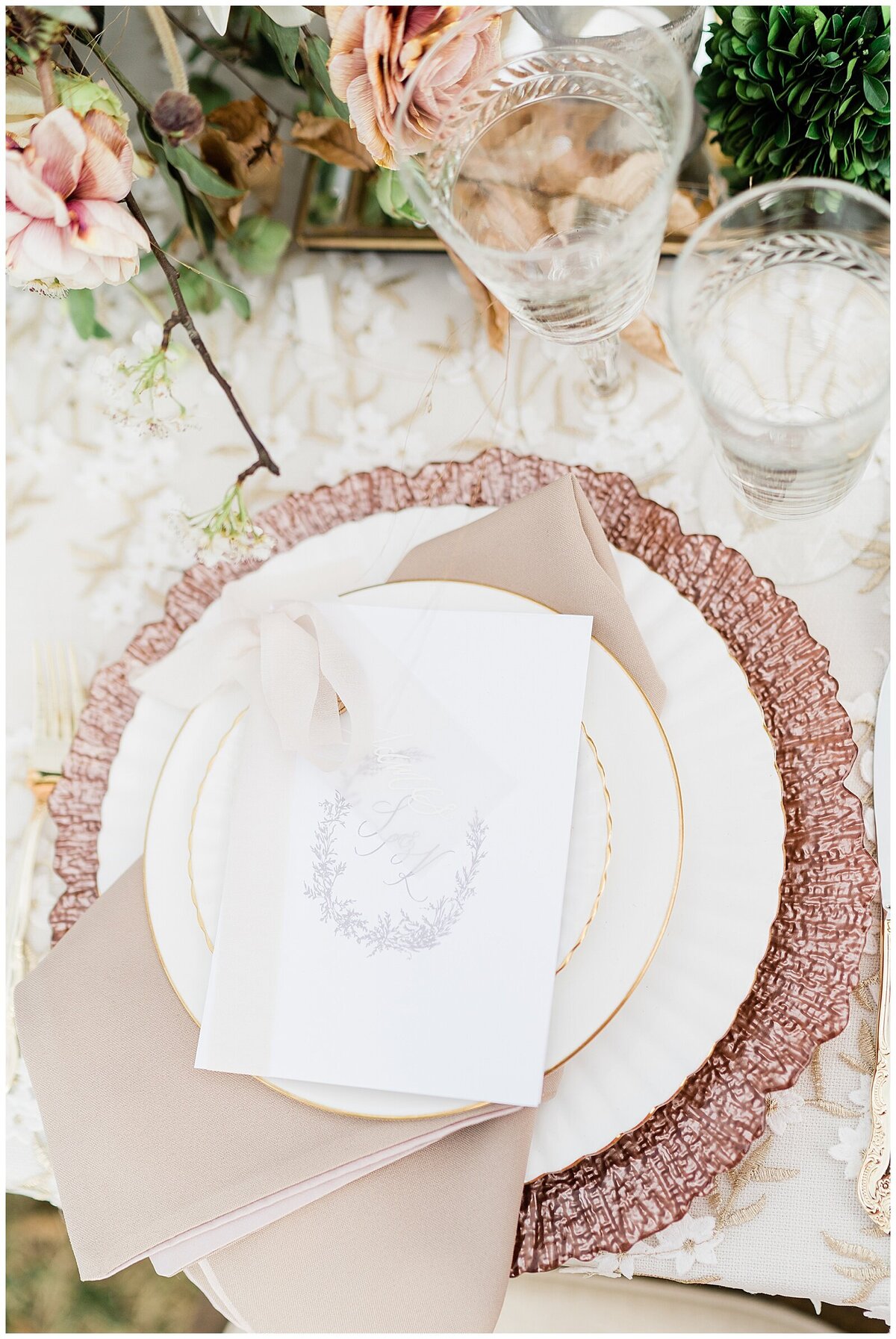 Place setting for wedding with pink accents