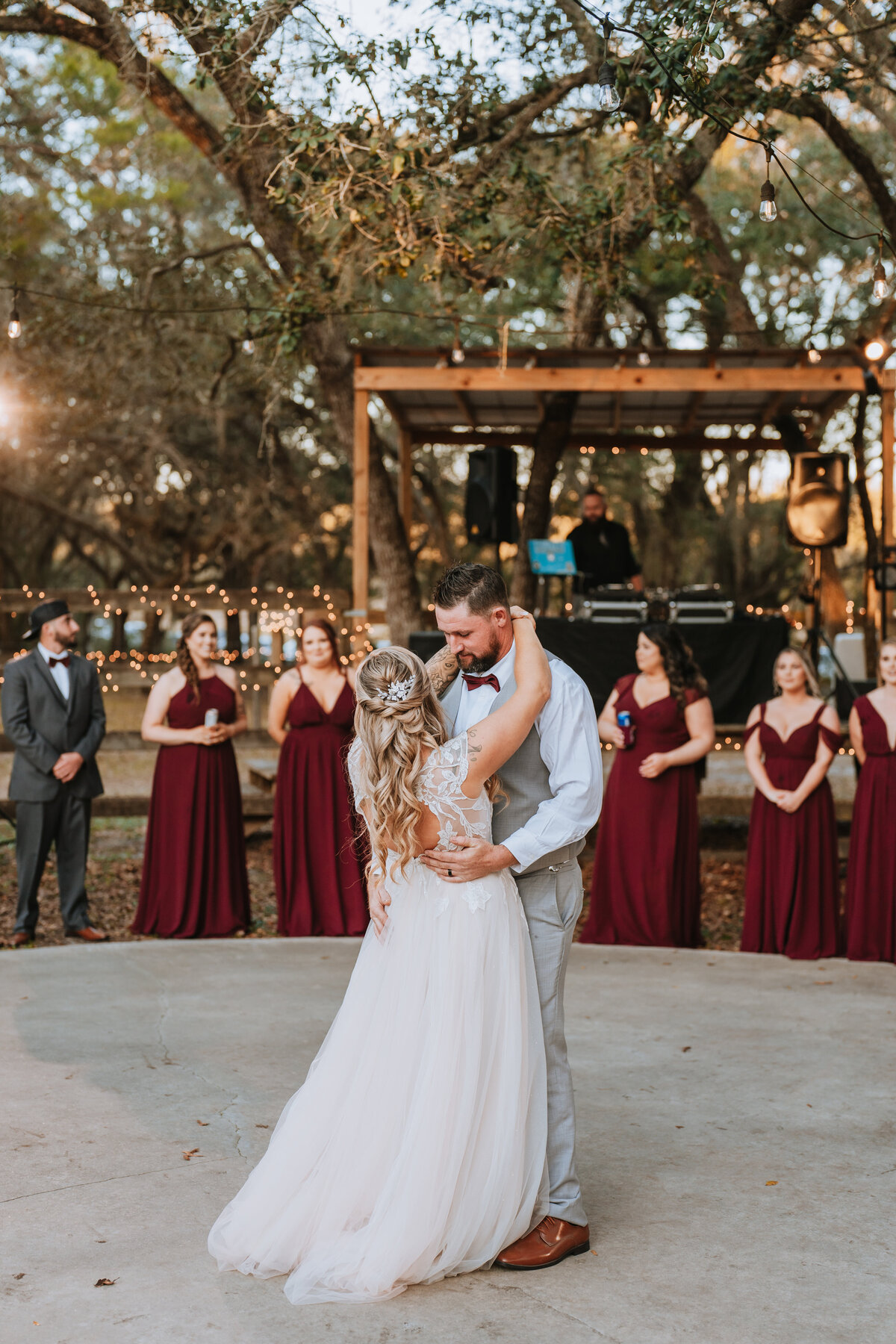 bride and groom sharing first dance at barn venue