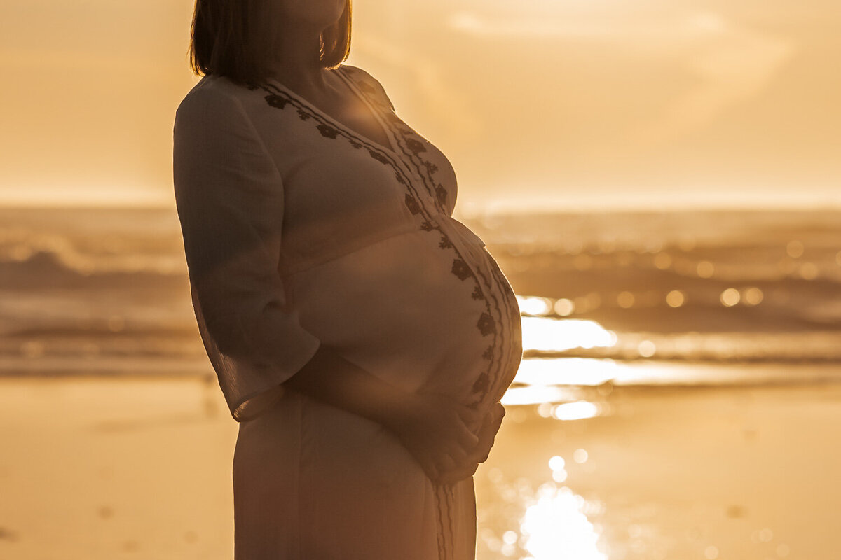 baby belly at sunset on the beach
