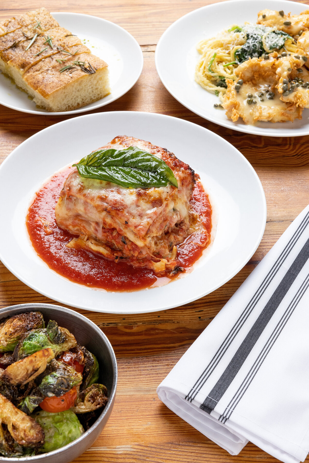 Pasta dishes and bread on a table