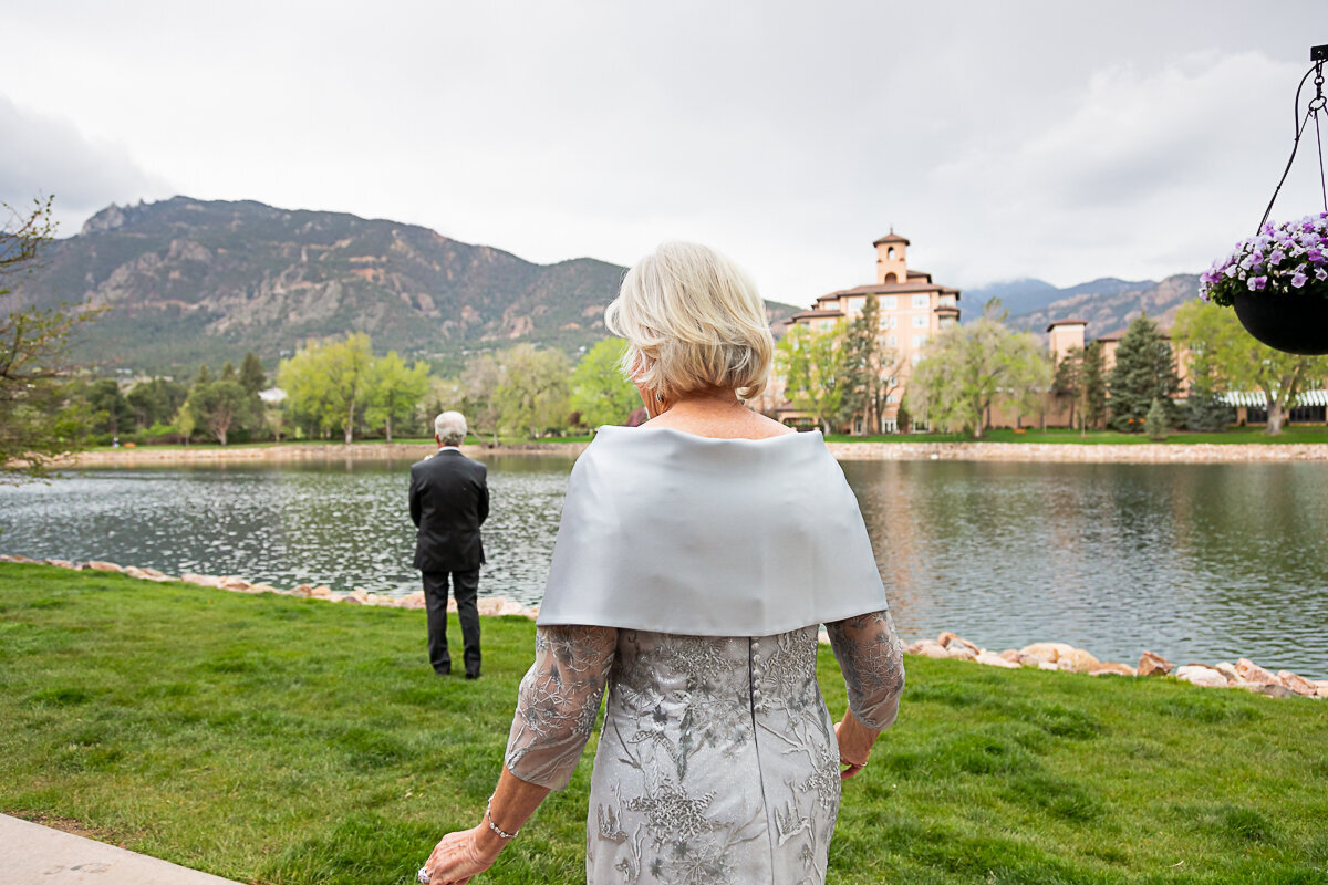 Bride walks up to her Groom for a First Look at the Broadmoor