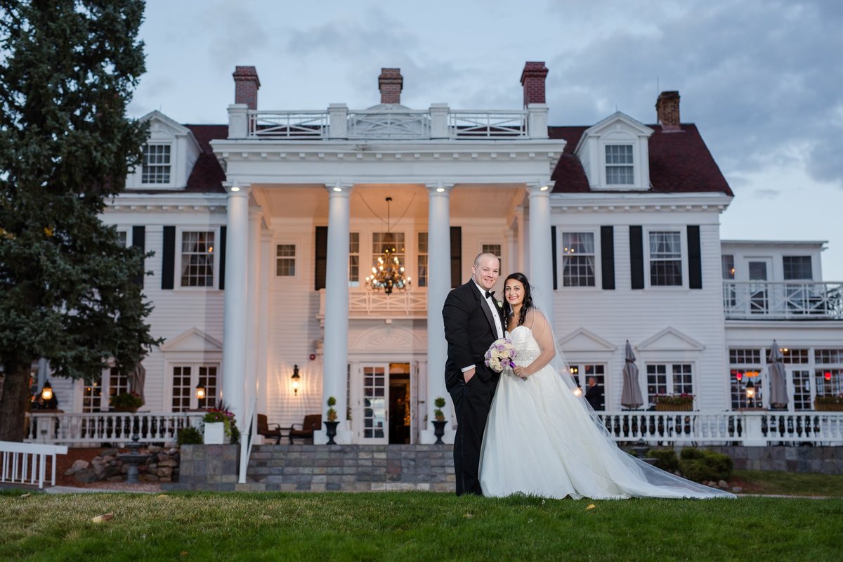 wedding couple in front of The Manor House
