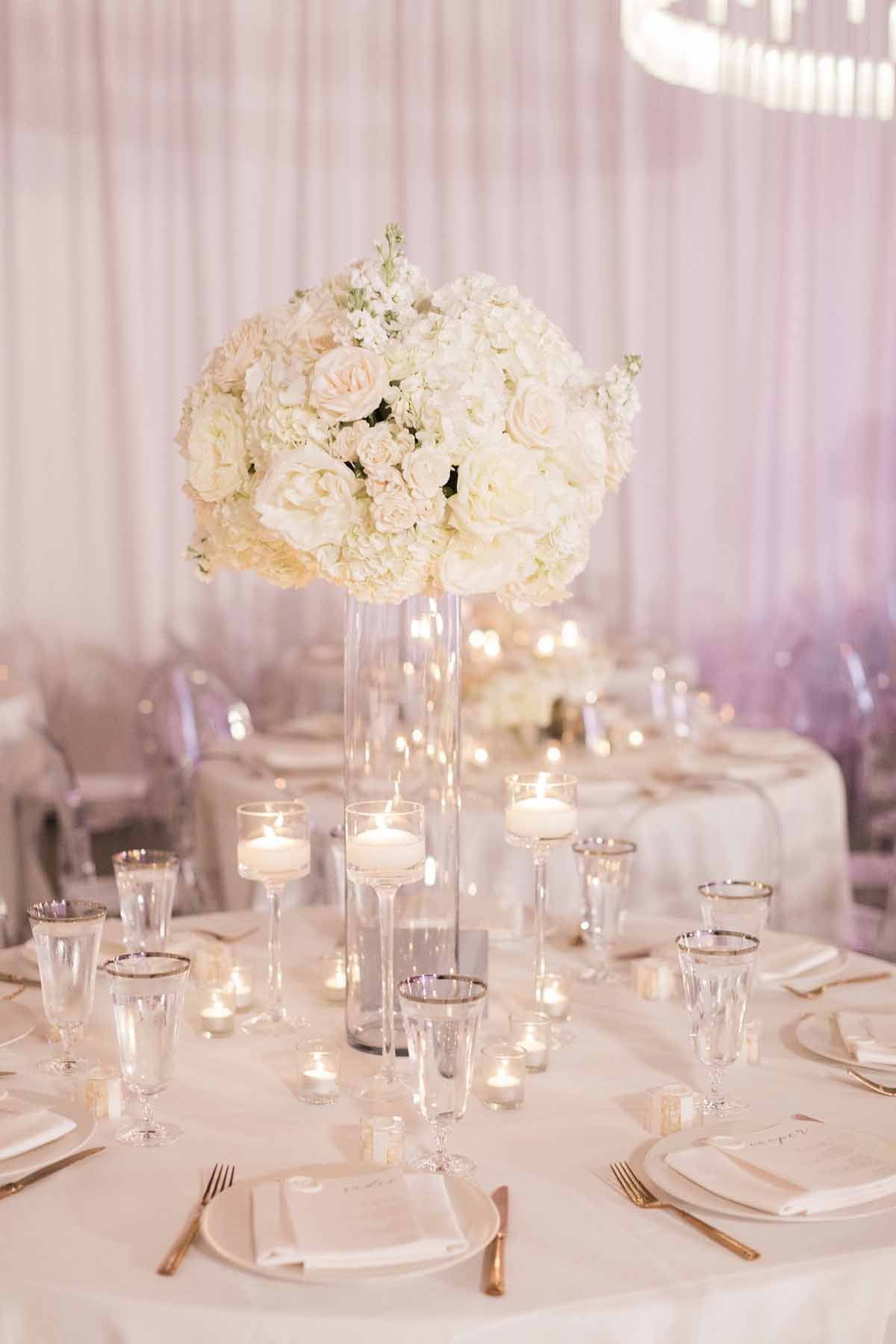 Such a romantic and soft look of all white roses  and hydrangea paired with tons of candles!