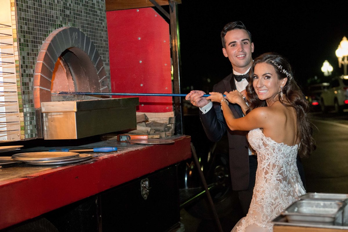 Bride and groom making pizza at Giorgio's Baiting Hollow