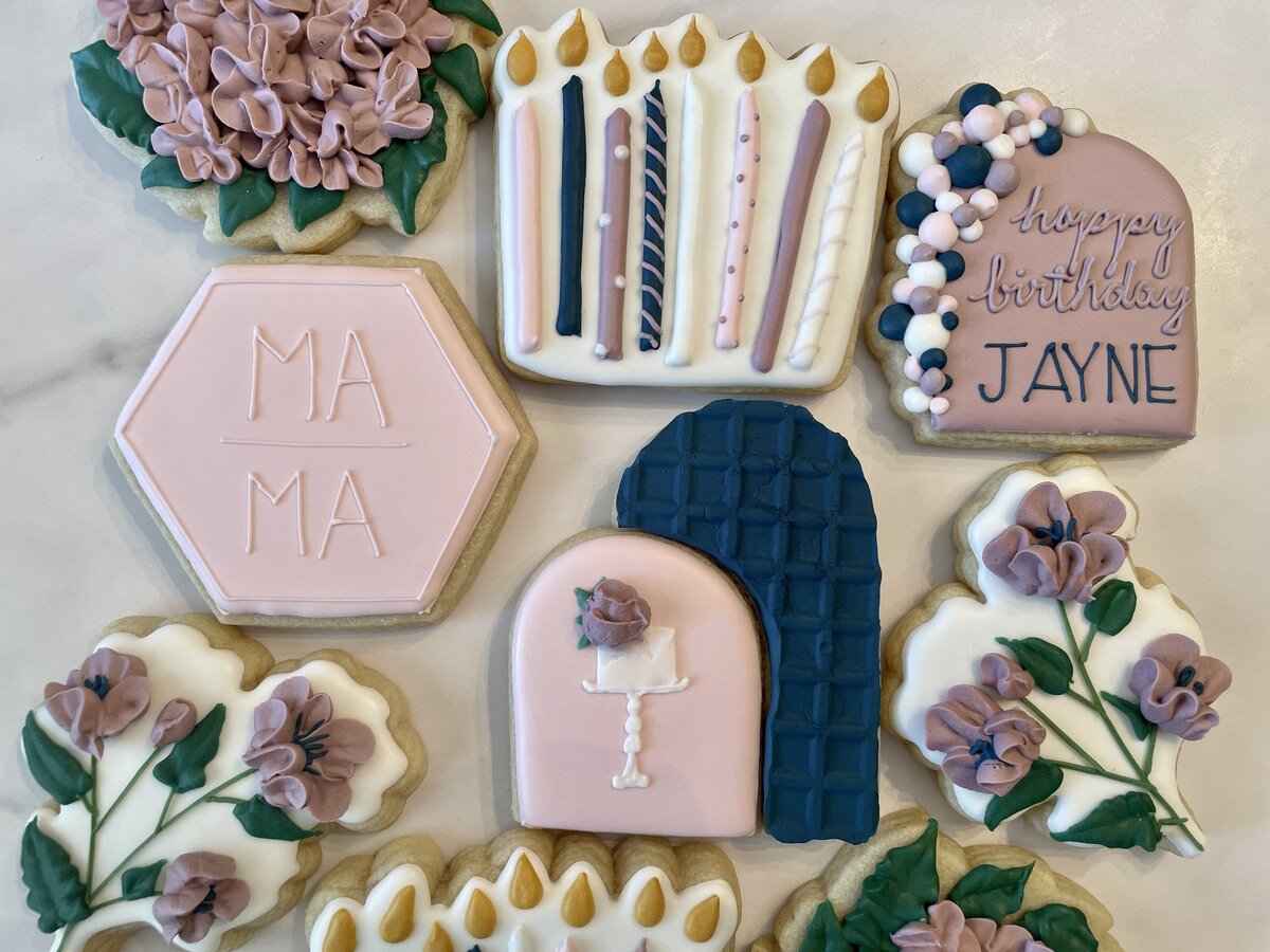 Custom-designed fancy sugar cookies with intricate icing details, perfect for birthdays, made in Gilbert