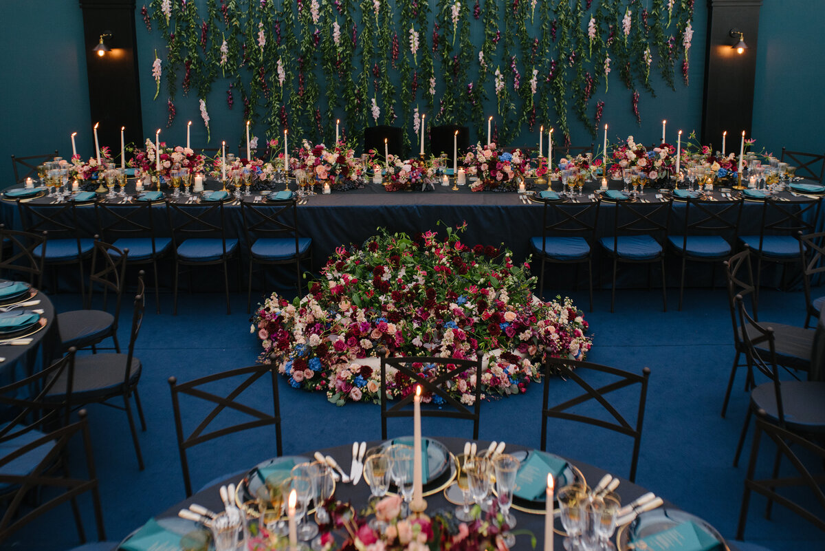 Luxury table of honor, fresh flowers and vegetal wall