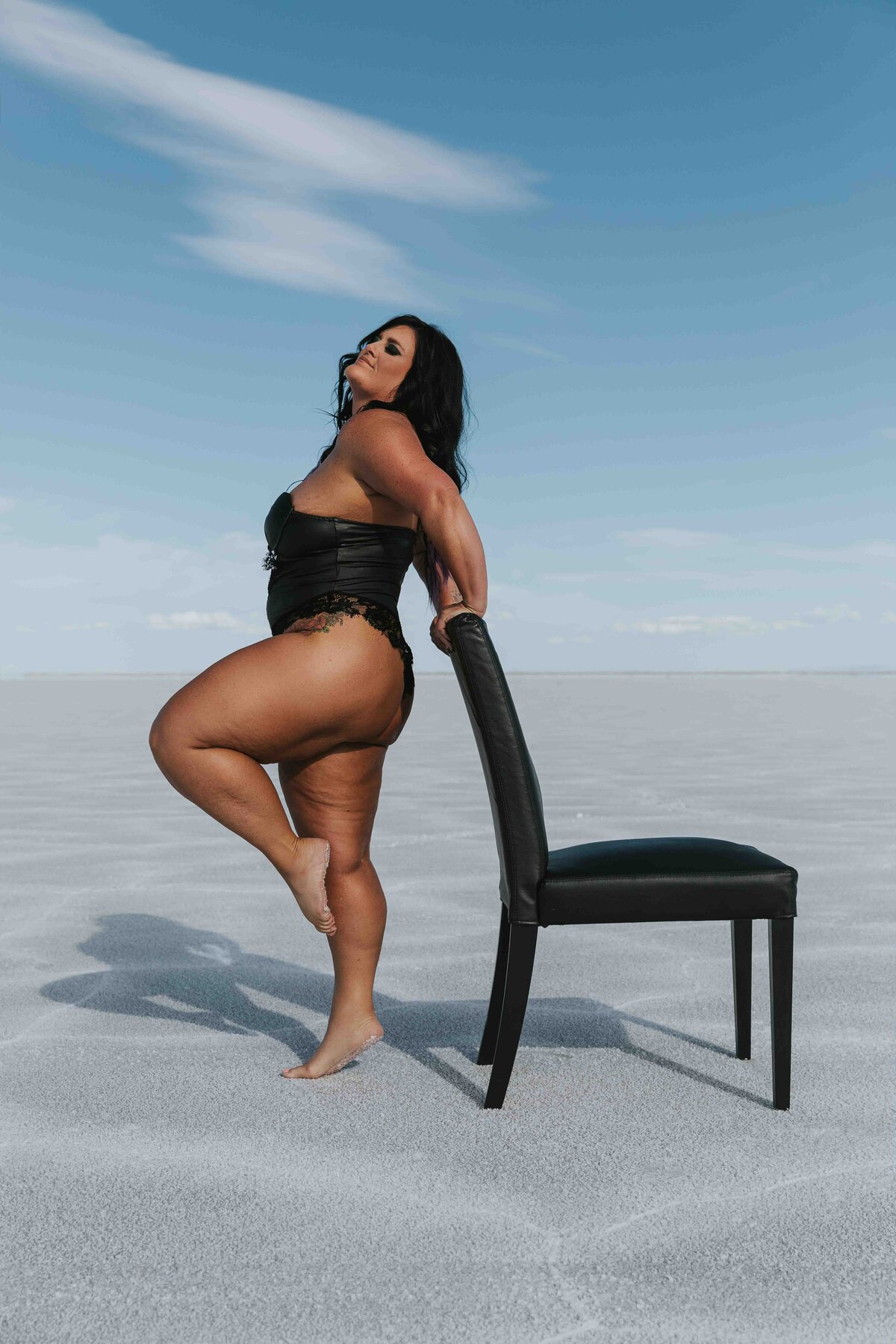 Woman posing with a chair on the salt flats