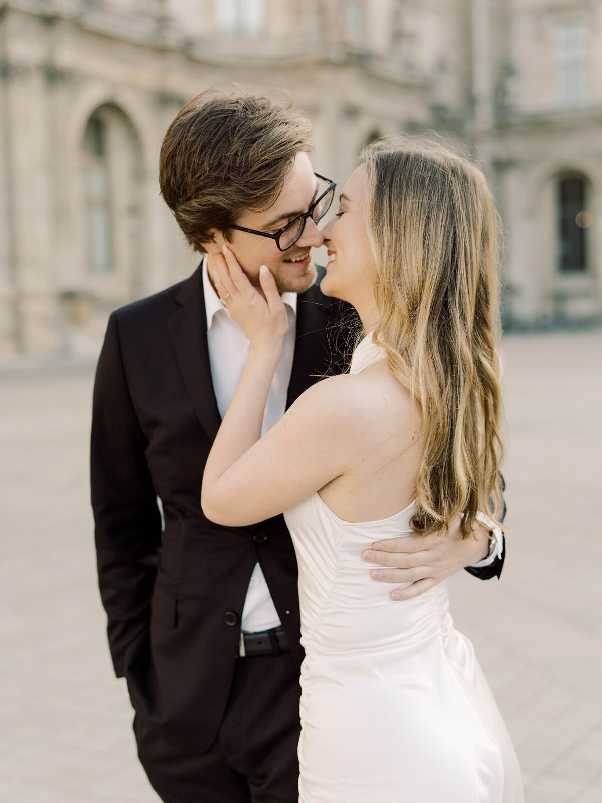 couple-at-engagement-session-at-the-louvre-with-sarah-sunstrom-photography