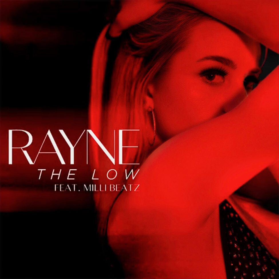 Single Cover Artist Rayne Title The Low red toned black and white image of singer with her arm folded and touching the top of her head hiding her mouth and chin