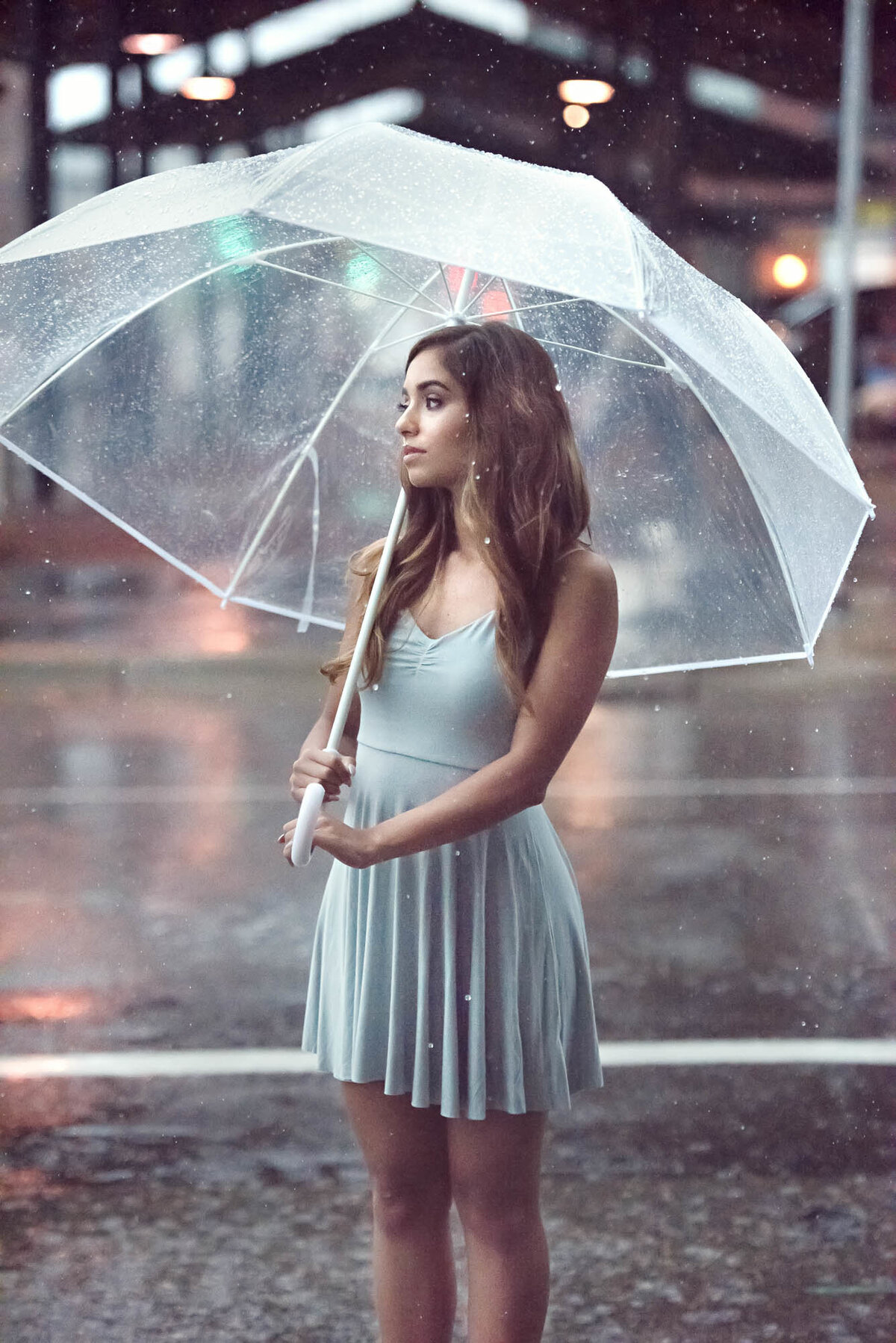 Senior portrait with umbrella in the rain