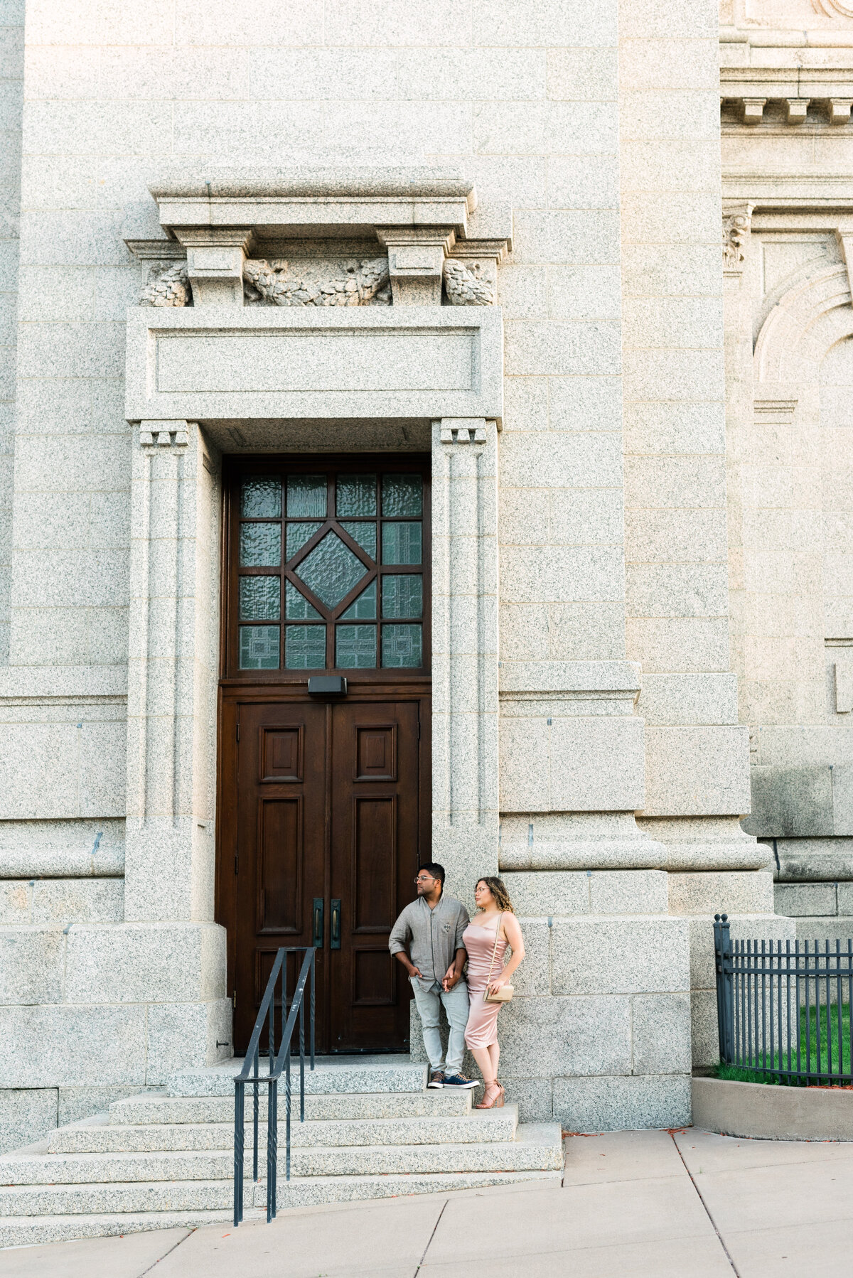 Couple standing and looking in the distance at the Cathedral of St. Paul
