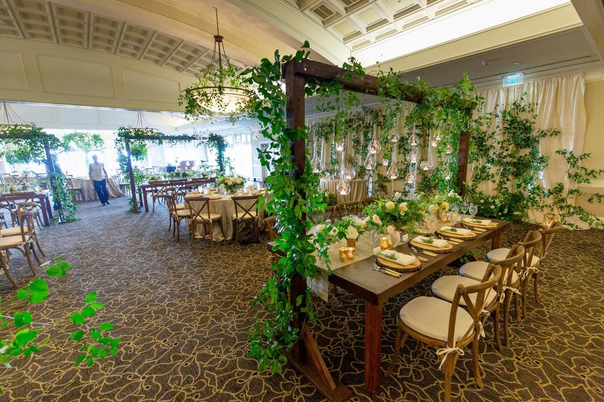 wooden tables with vineyard chairs for wedding reception at Newcastle ballroom