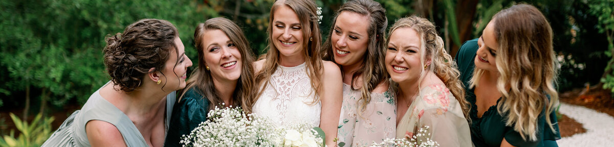 Bridesmaids are all smiles on the wedding day
