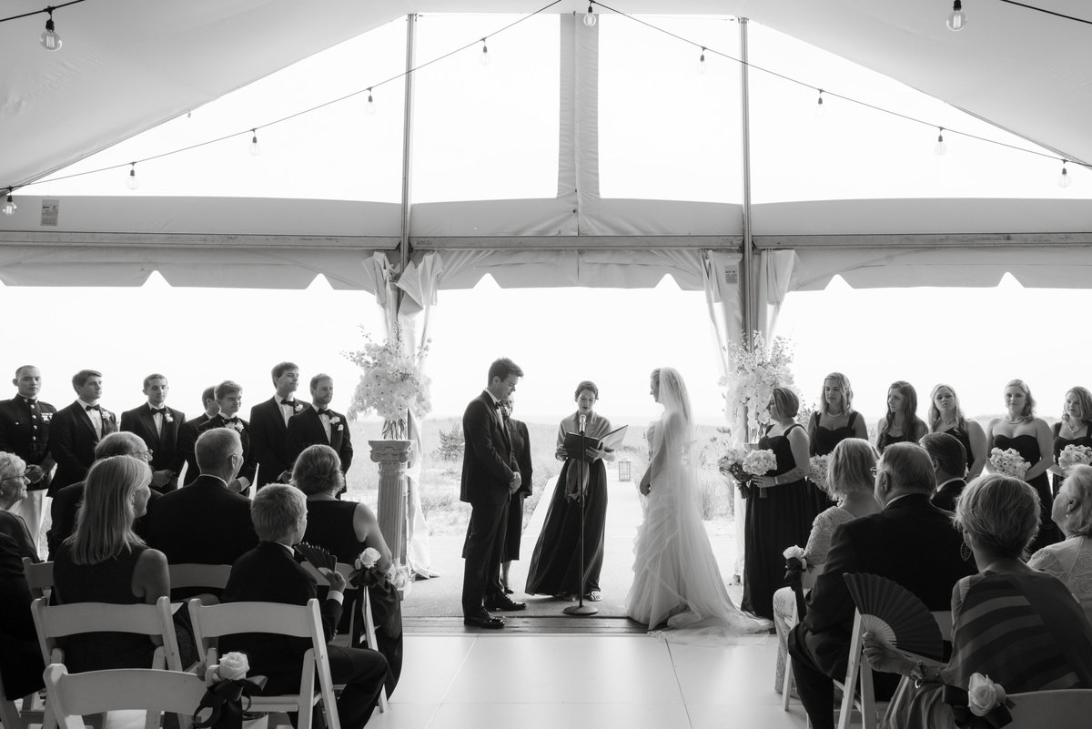 Black and white photo of wedding ceremony at Oceanbleu indoors