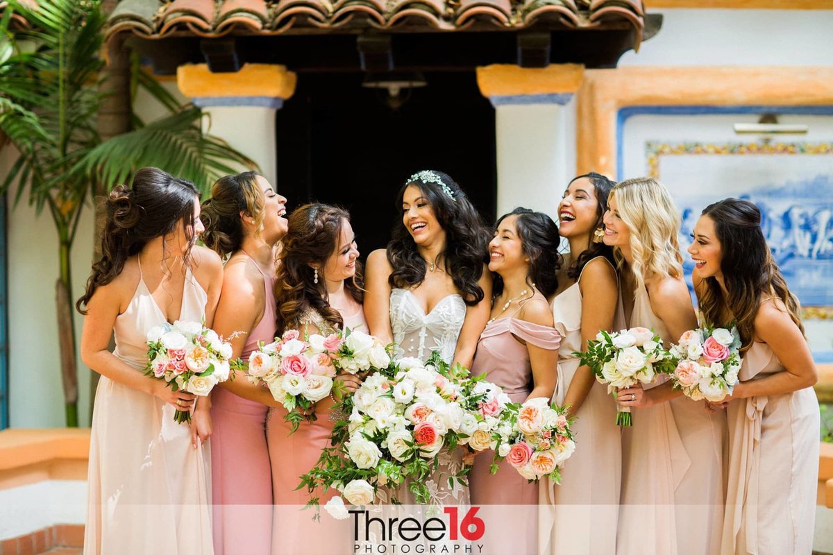 Bride shares a laugh with her Bridesmaids