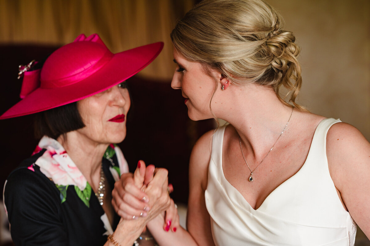 Bride and her mum having a moment before the wedding ceremony at stapleford park hotel