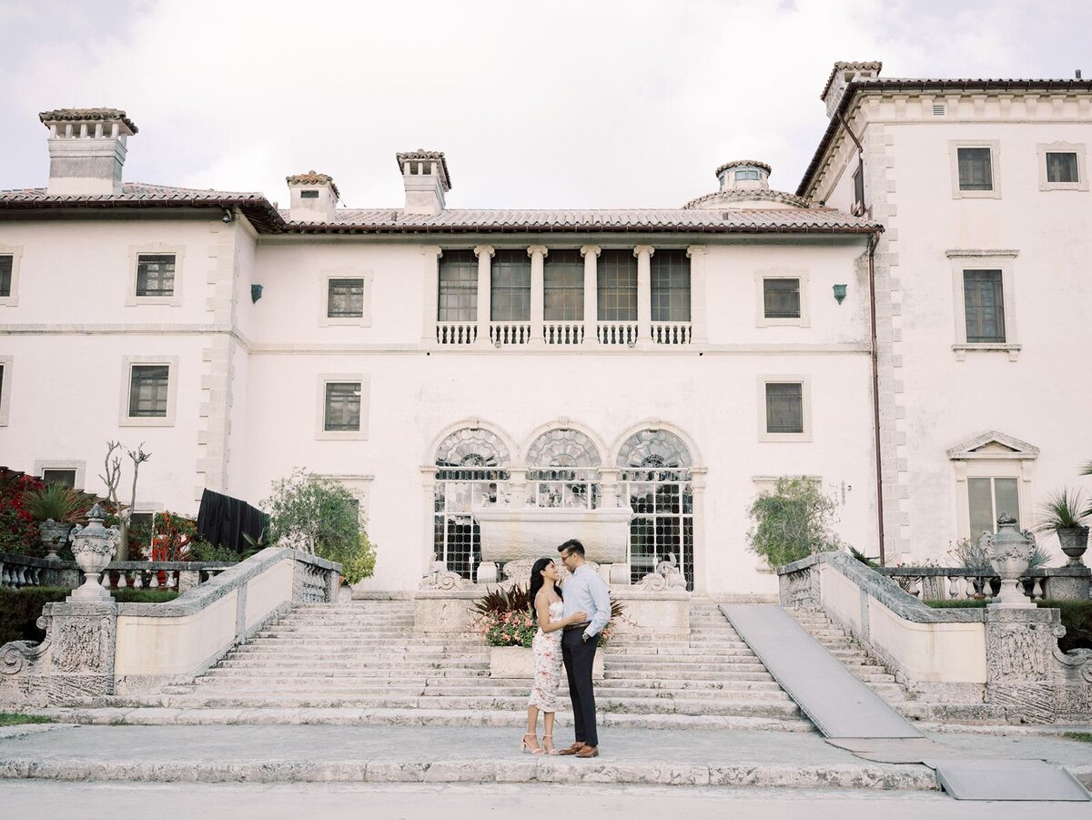 Couple-standing-in-the-gardens-at-Vizcaya-Museum-at-their-engagement-session-with-chicago-wedding-photographer-Sarah-Sunstrom-Photography