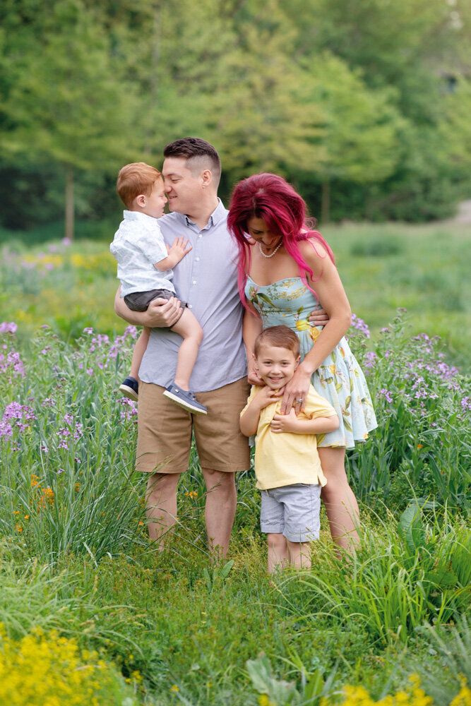 Family session located outside with lavender flowers