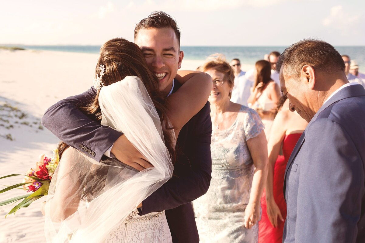 Guet congratulating bride after wedding in Cancun