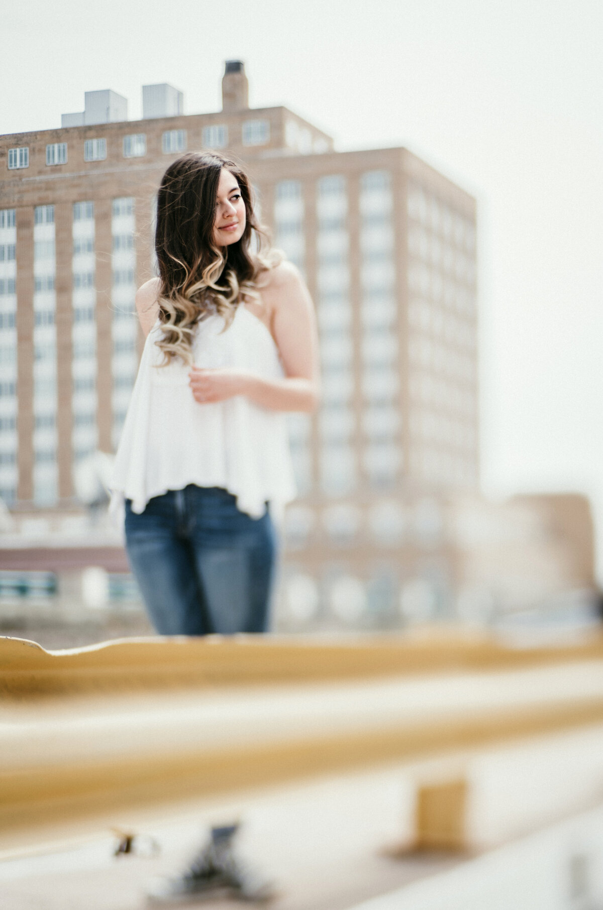 Indulge in rooftop reveries with senior portraits featuring skyline views. Shannon Kathleen Photography elevates your senior story against the backdrop of the city skyline. Secure your rooftop session