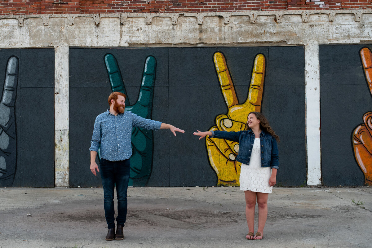 Couple stands six feet apart during engagement session