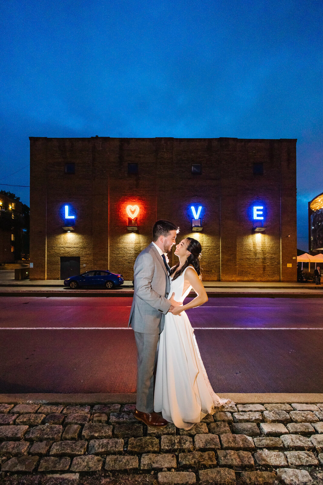 Visionary Art Museum Love sign with a bride and groom kissing