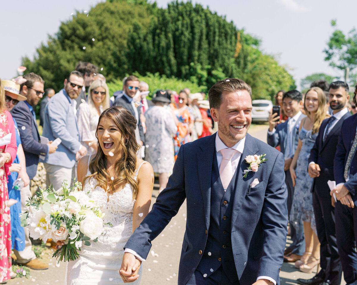 Bride and groom after church wedding in the Cotswolds