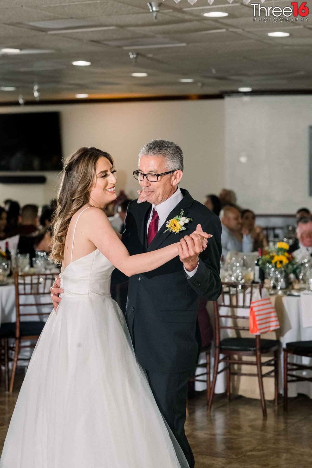 Bride and her father dance during her wedding reception at the Casa Bella Wedding Venue