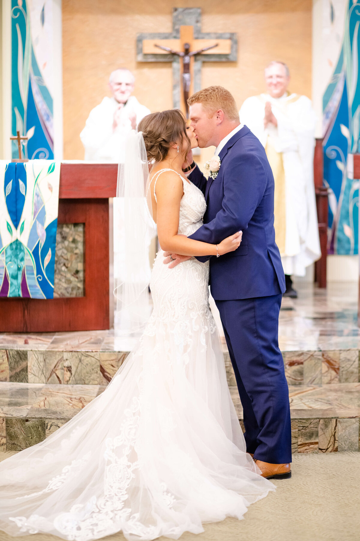 Husband and Wife celebrate their first kiss inside Catholic Church in Grand Island