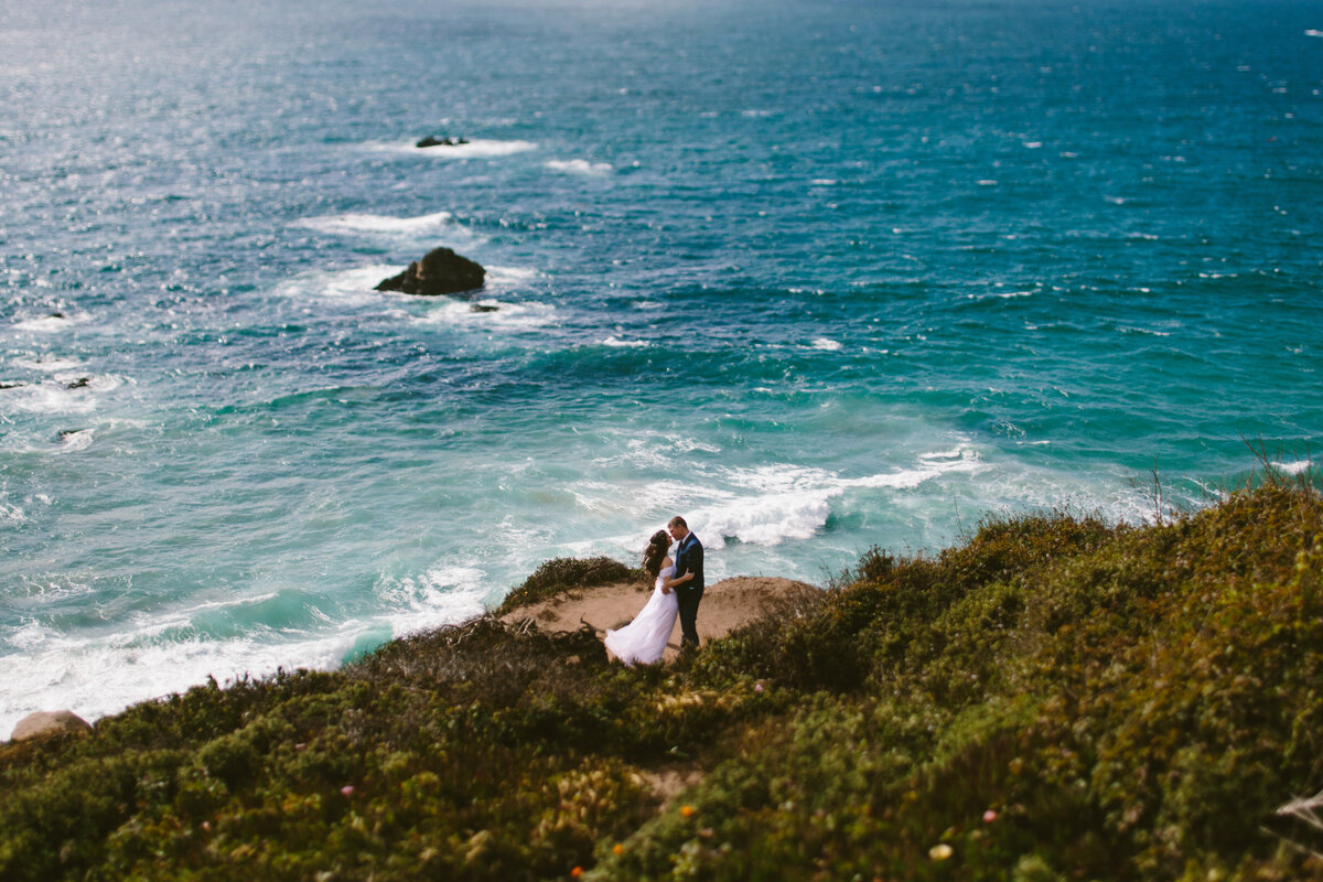 Bride and Groom overlooking ocean