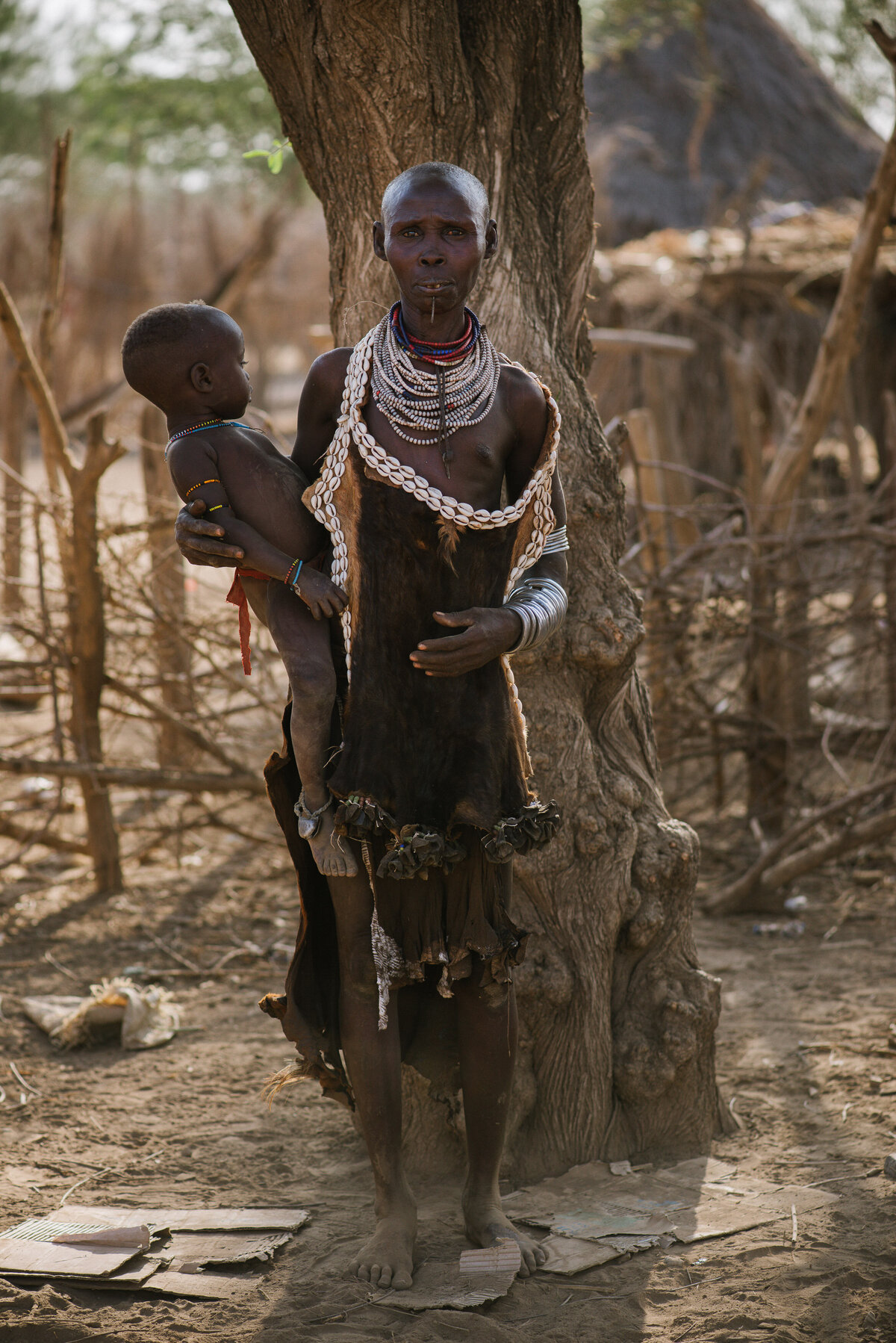 Traditional dress for kara women with neclaces and handmade clothing in omo river valley