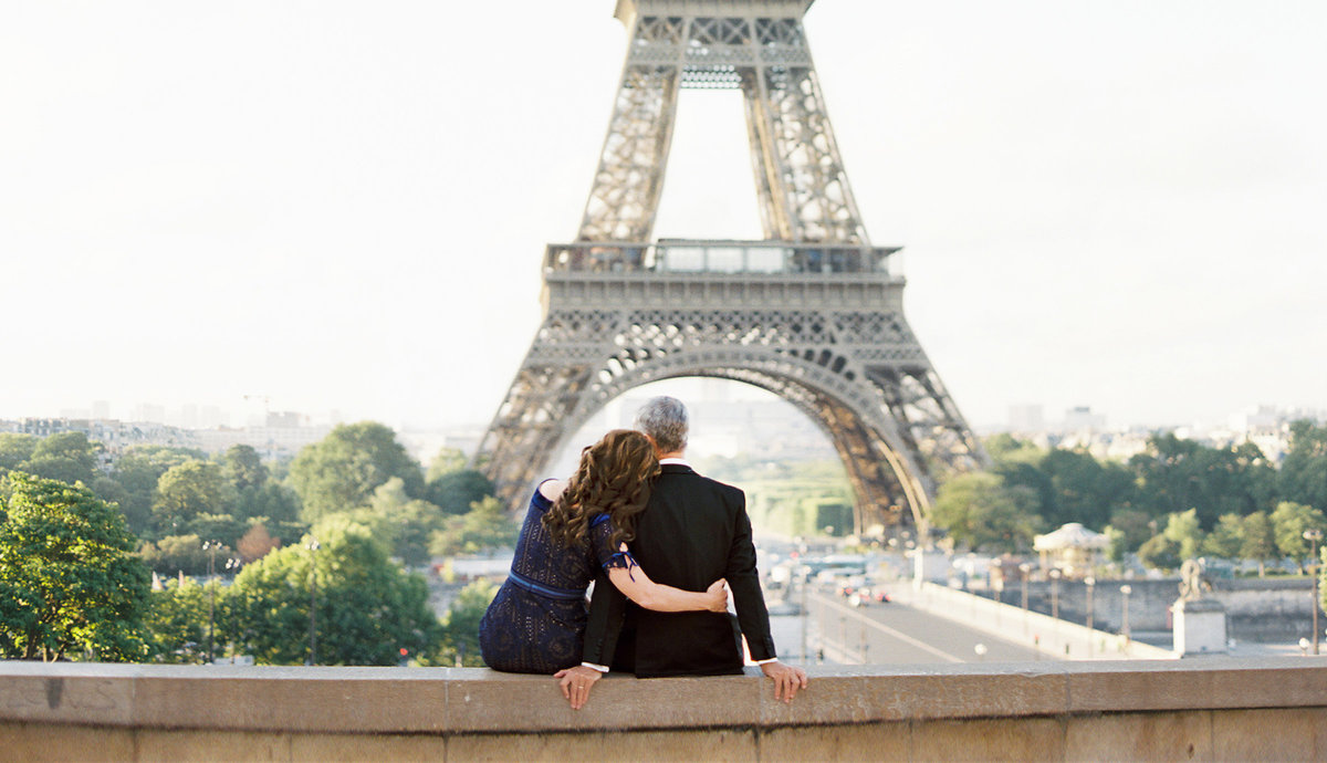 Couple embraces in front of Eiffel Tower 33