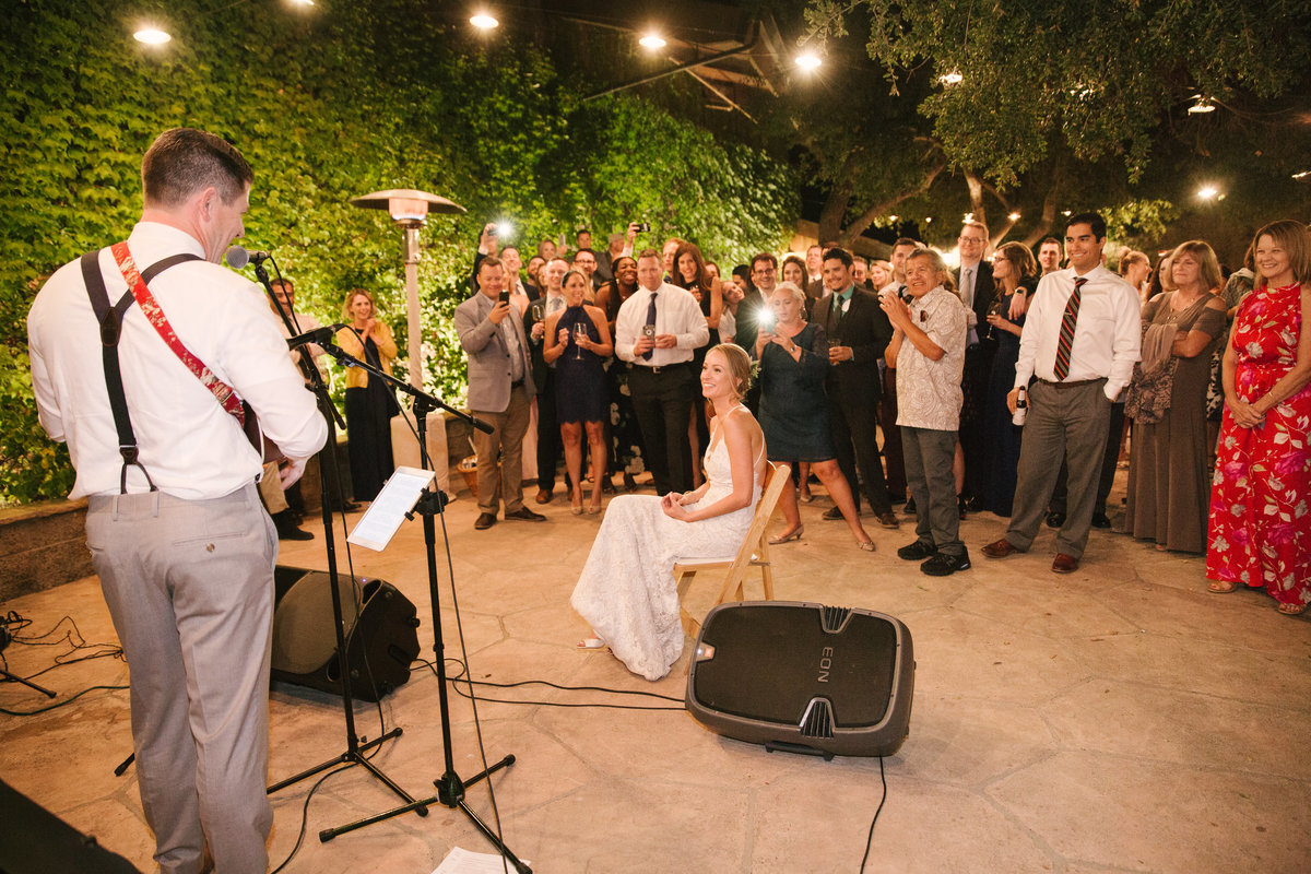 Groom sings song to bride at Firestone Vineyard wedding