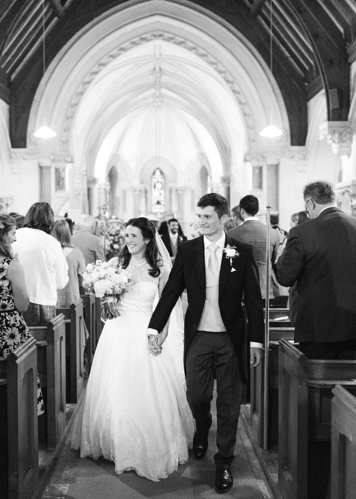 chloe-winstanley-weddings-wiltshire-church-ceremony-bride-groom-exit