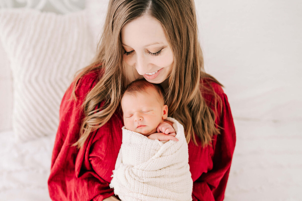 close up of mom and baby boy cuddling during Springfield Mo newborn photography session
