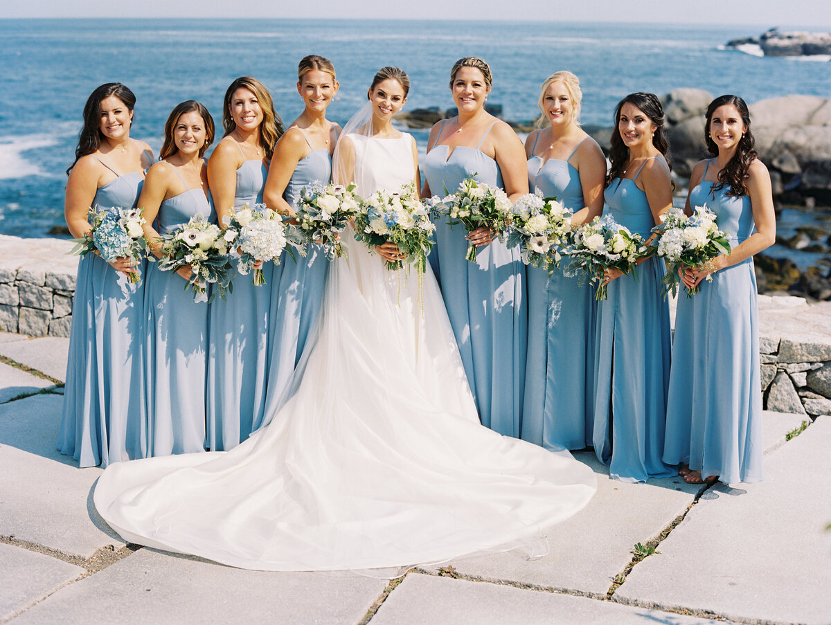 Bride with bridesmaids in dusty blue dresses