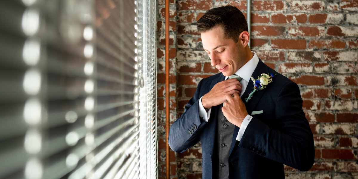 groom prep reading photographer