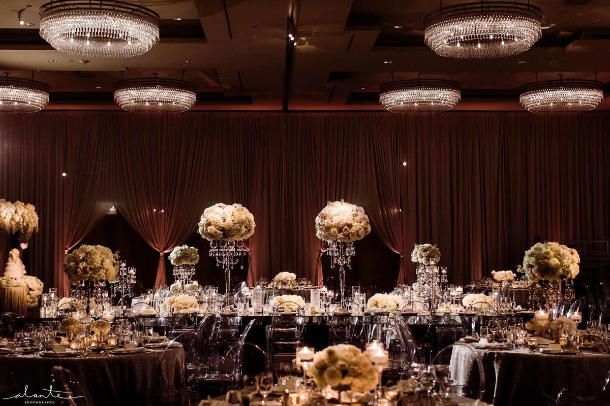 Romantic winter wedding reception with all white classic rounded floral.