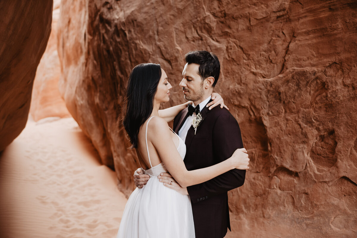 Utah elopement photographer captures groom smiling at bride