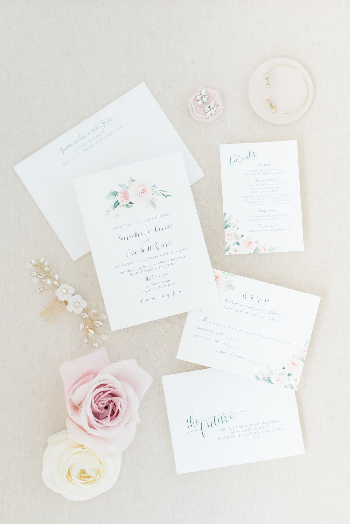 wedding-invitations-with-flowers-on-styling-board