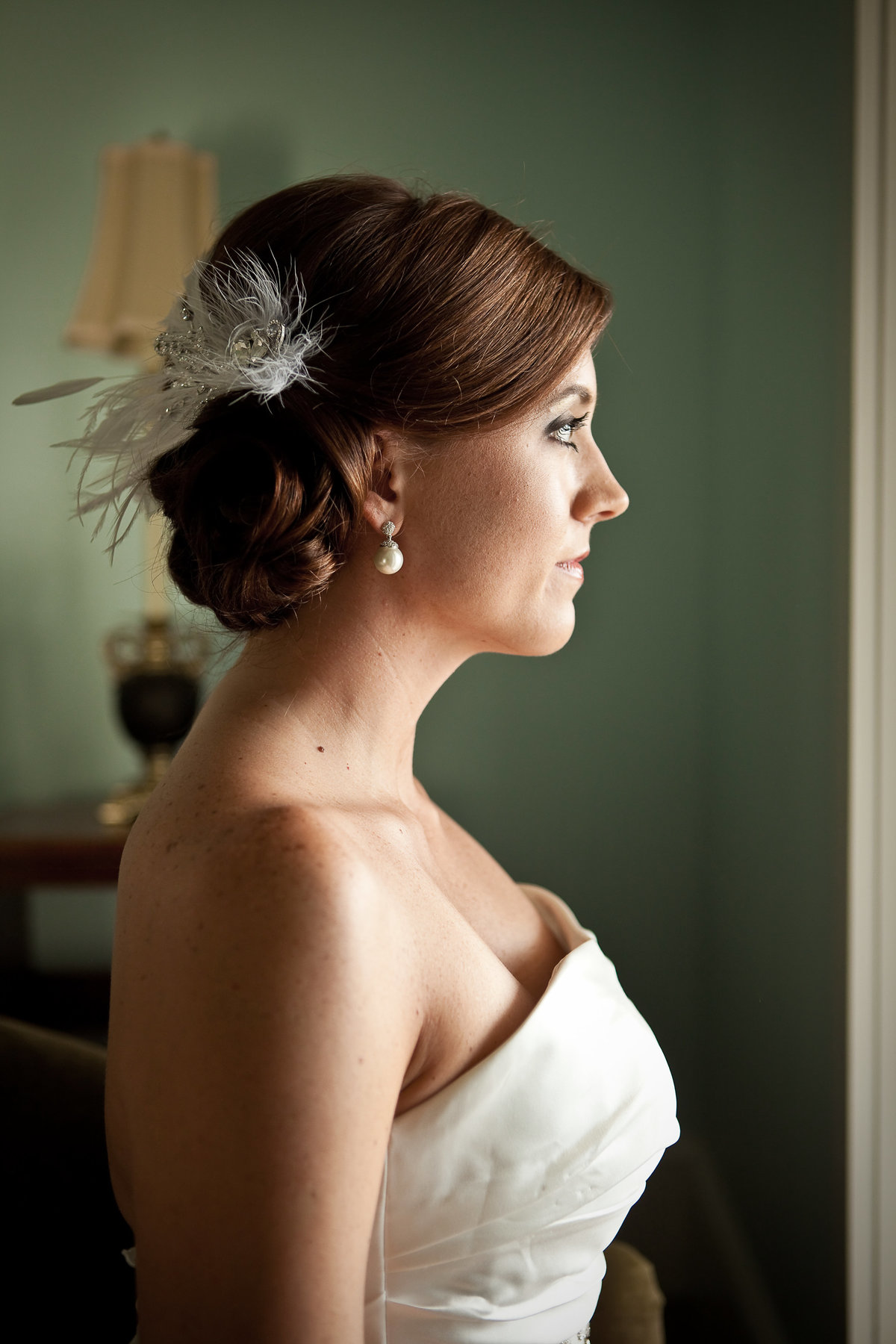 Profile shot of naturally lit bride at Emma's Bay House in Fairhope, Alabama.