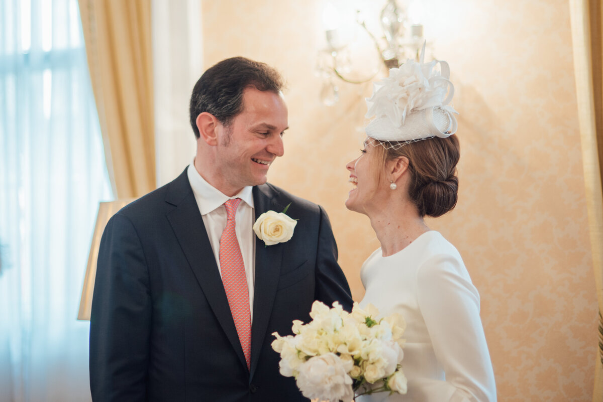 A couple laughing together in the middle of their ceremony  taken by London Wedding Photographer Liberty Pearl