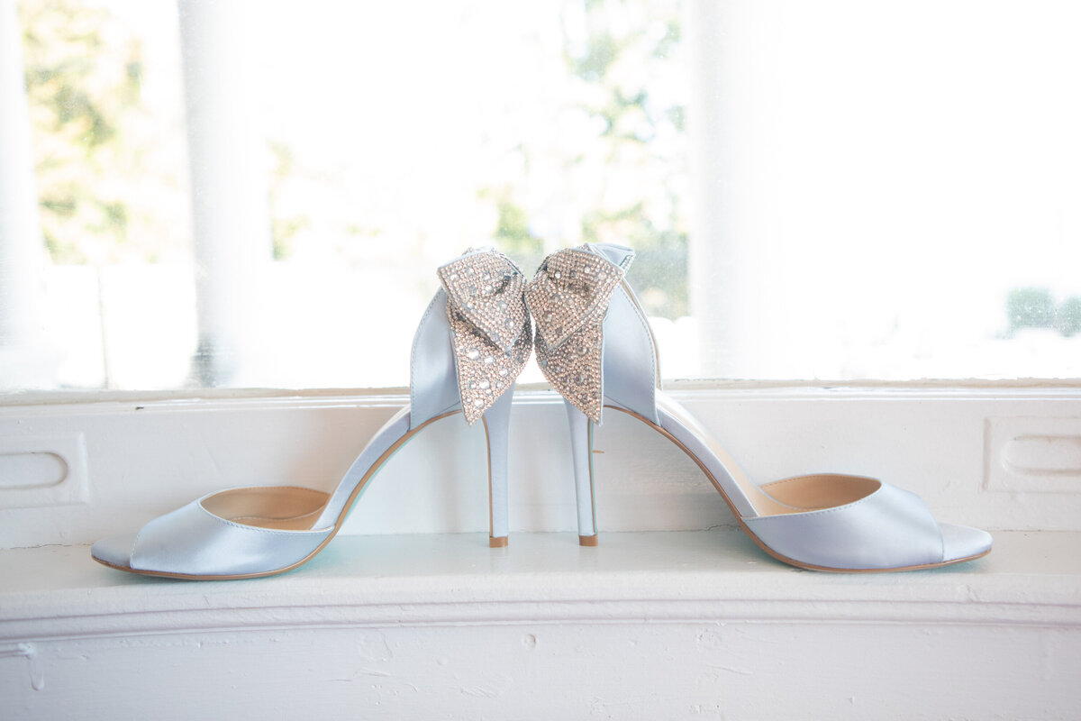 still life of light blue satin wedding shoes with jeweled bows Haverstraw Ellks Club wedding photographer Rockland County