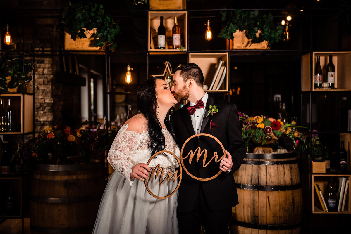 Couple sharing a kiss inside of City Winery during an elopement