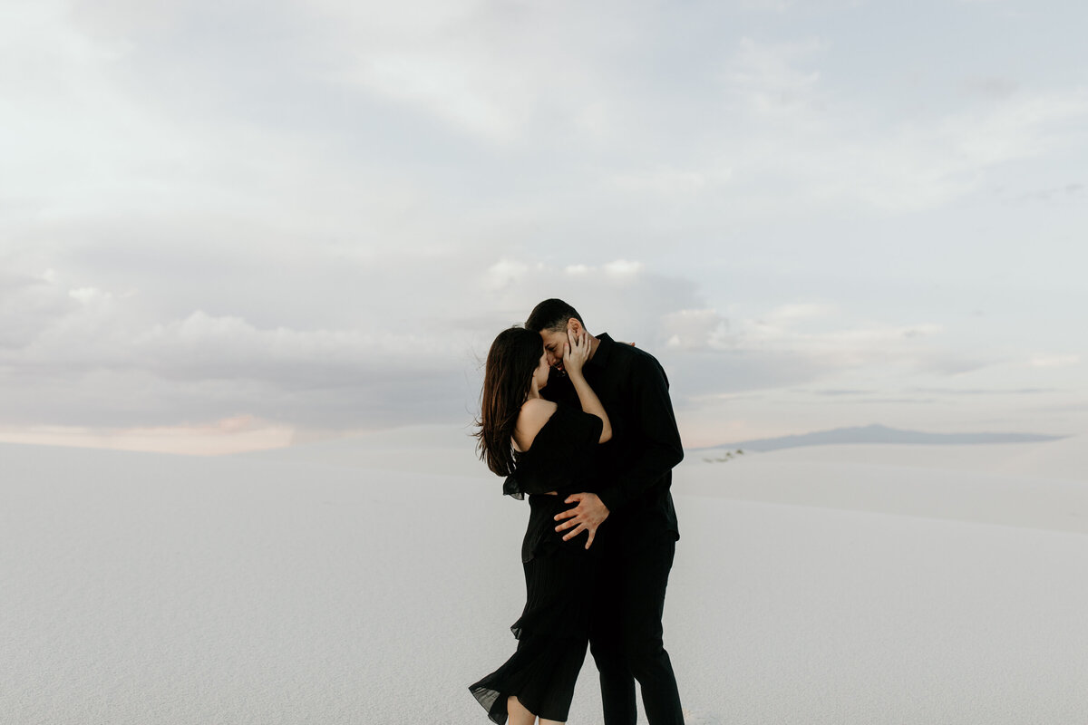 man and woman kissing at white sands in new Mexico