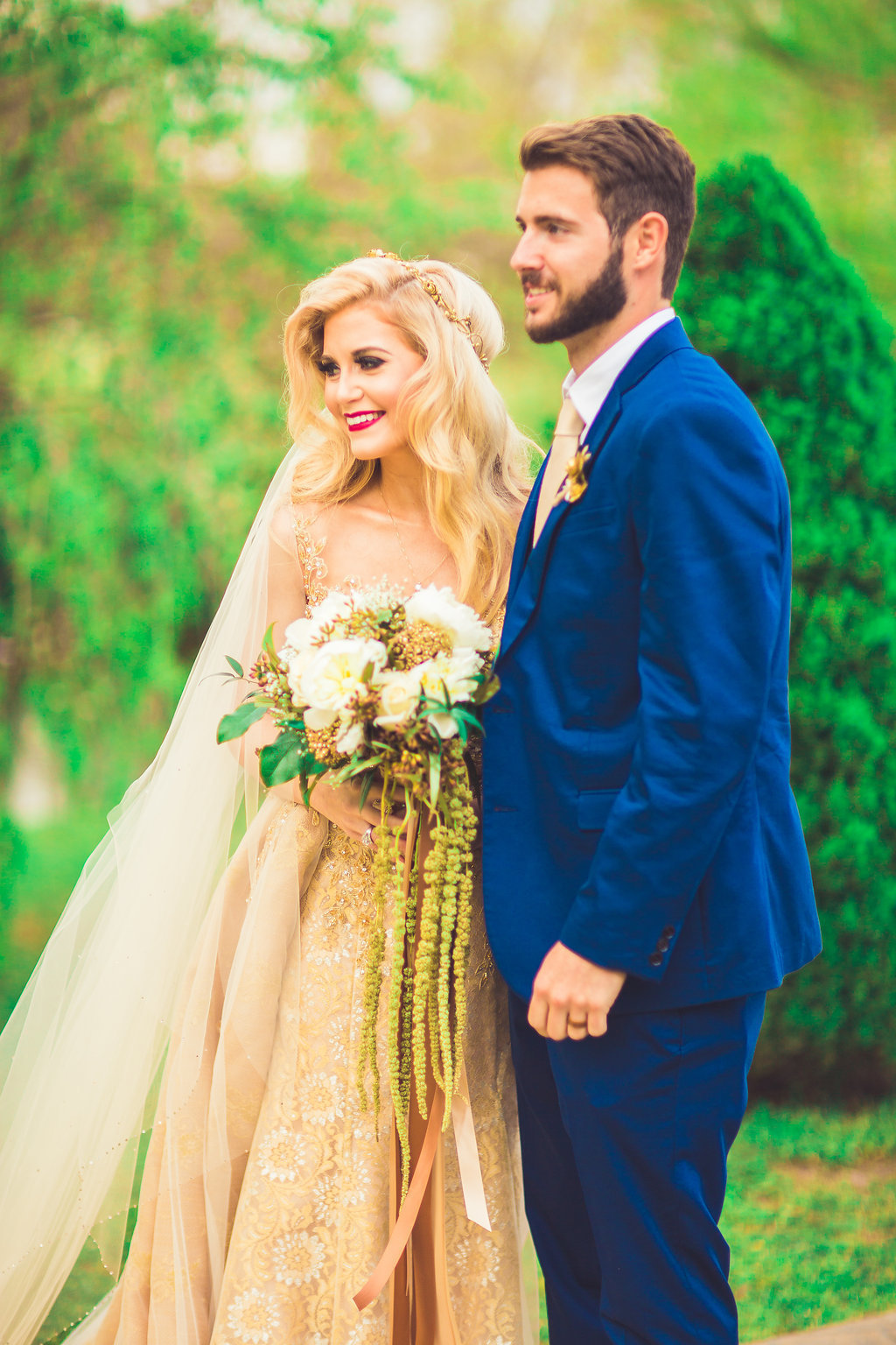 Wedding Photograph Of Bride and Groom in Blue Suit Posing for a Camera Shot Los Angeles