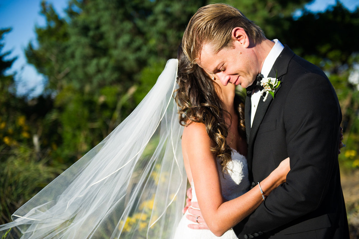 bride and groom share emotional moment