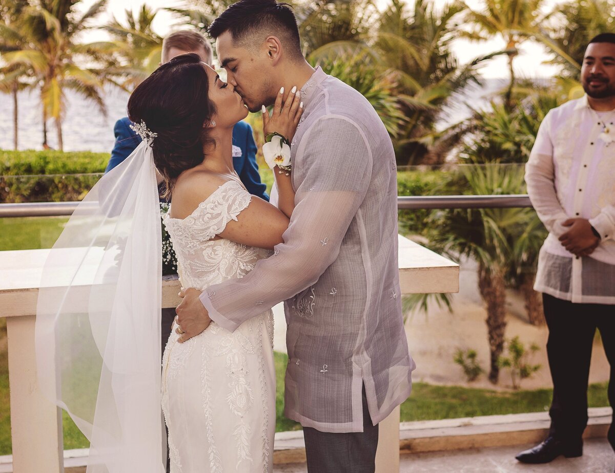 Bride and Grooms first kiss at wedding in Cancun