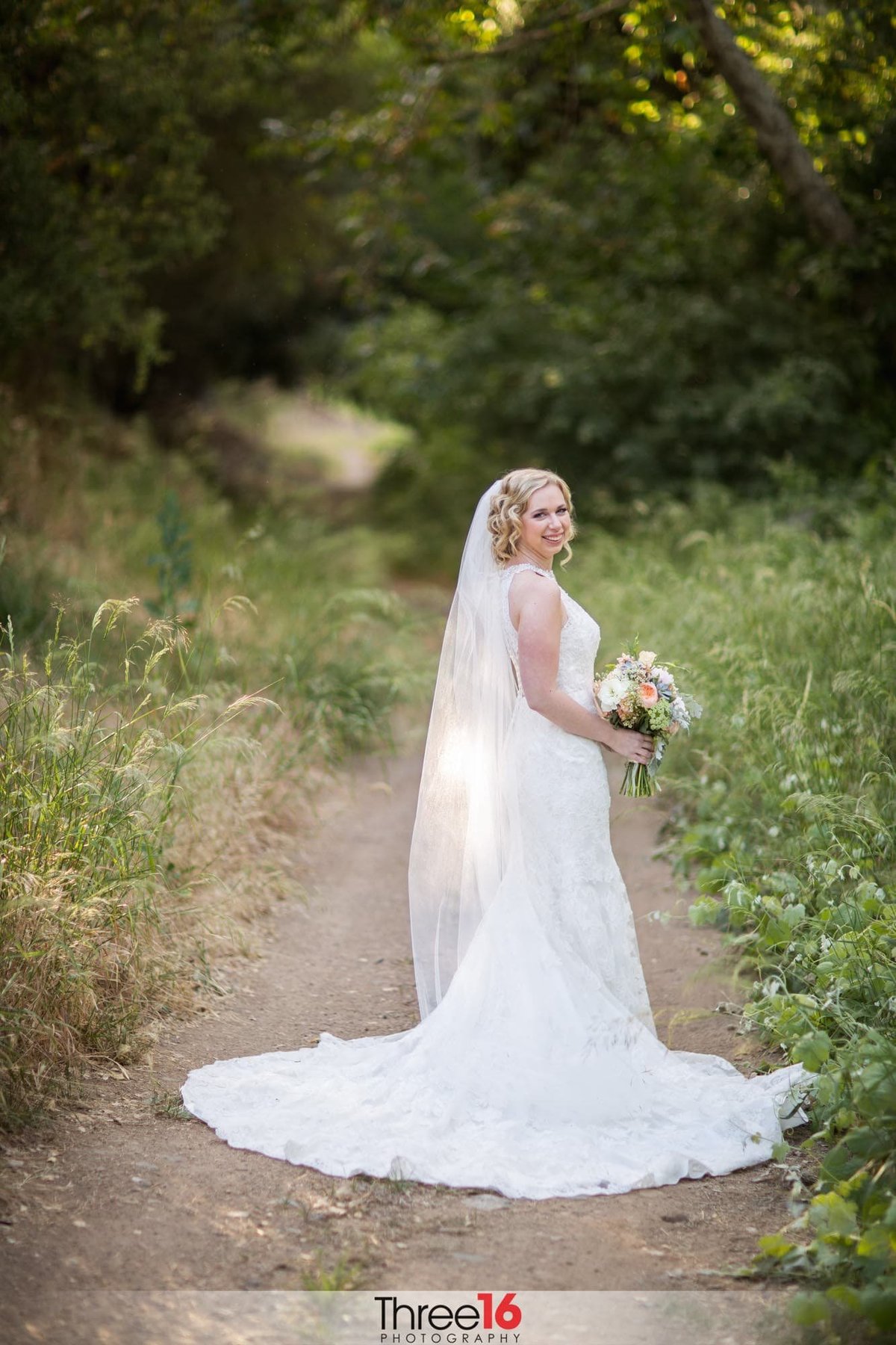 Bride posing for wedding photographer at Vista Valley Country Club