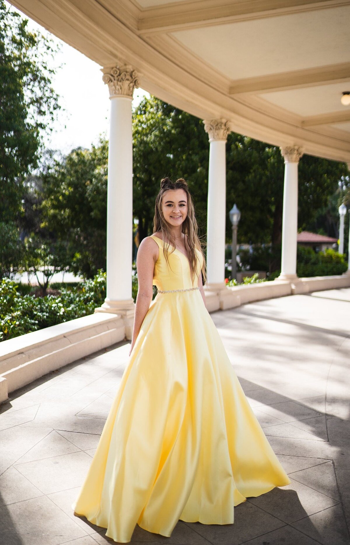 Girl posing in yellow gown for Senior Photos at Balboa Park San Diego California